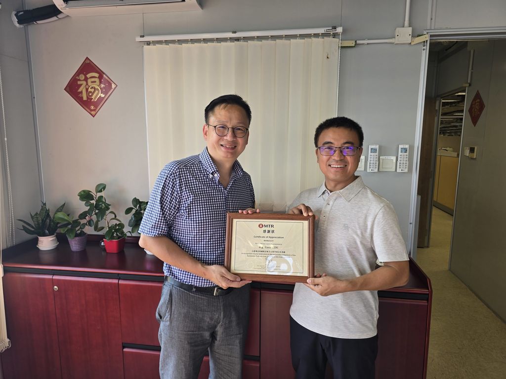 MTR Hong Kong representative (left) presents Certificate of Appreciation to BEA Technical Manager Simon Cheng (right)